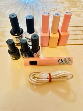 gel nail polishes along with a UV nail lamp